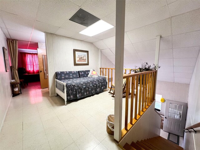 5260 County Road 268, Anson, TX 79501 - bedroom featuring tile patterned floors and a drop ceiling