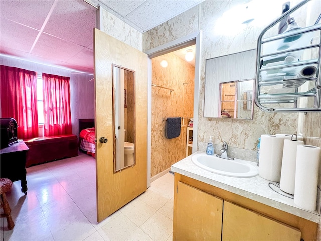 5260 County Road 268, Anson, TX 79501 - bathroom featuring vanity, a paneled ceiling, and tile patterned floors