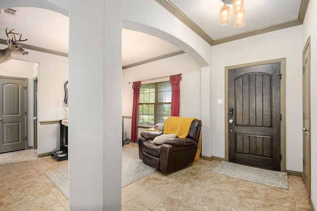 407 Dill Rd, Weatherford, TX 76085 - foyer entrance featuring arched walkways, crown molding, and stone finish flooring
