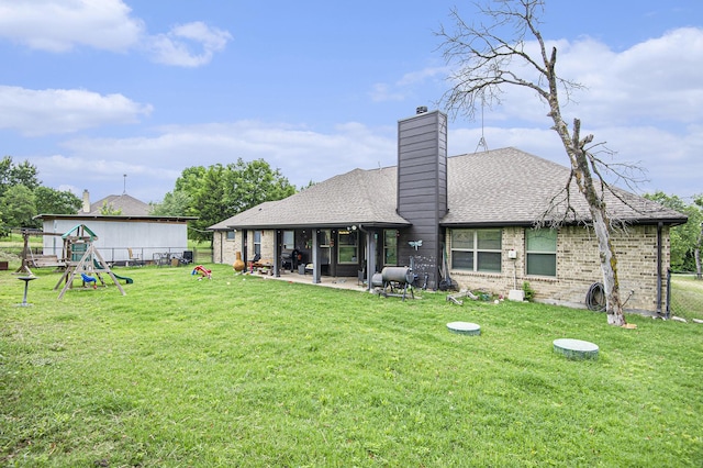 407 Dill Rd, Weatherford, TX 76085 - back of house with a patio area, a chimney, a shingled roof, and brick siding