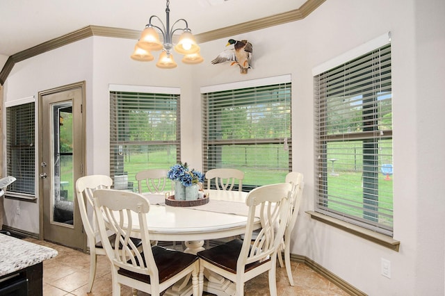 407 Dill Rd, Weatherford, TX 76085 - dining room with crown molding, light tile patterned floors, a chandelier, and plenty of natural light