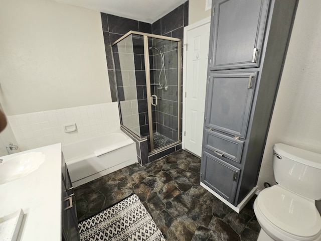 5913 Lake Hubbard Pkwy Unit 124, Garland, TX 75043 - full bathroom with a garden tub, a shower stall, vanity, stone finish flooring, and toilet