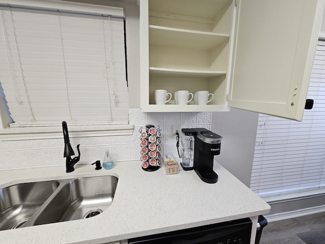 5913 Lake Hubbard Pkwy Unit 124, Garland, TX 75043 - kitchen featuring a sink, decorative backsplash, dishwasher, and light stone counters