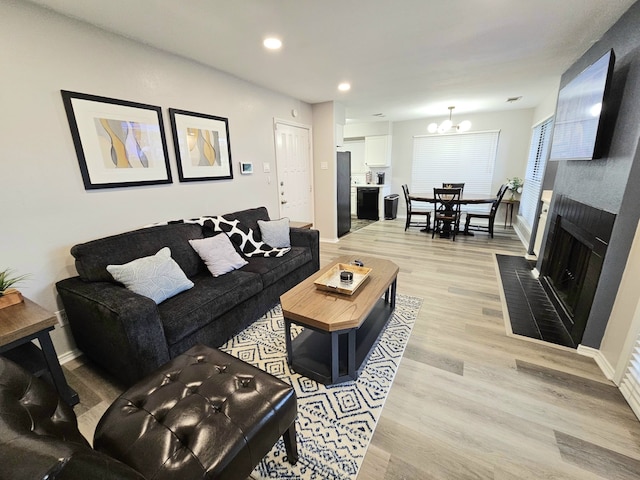 5913 Lake Hubbard Pkwy Unit 124, Garland, TX 75043 - living area featuring a chandelier, light wood-style floors, baseboards, a fireplace, and recessed lighting