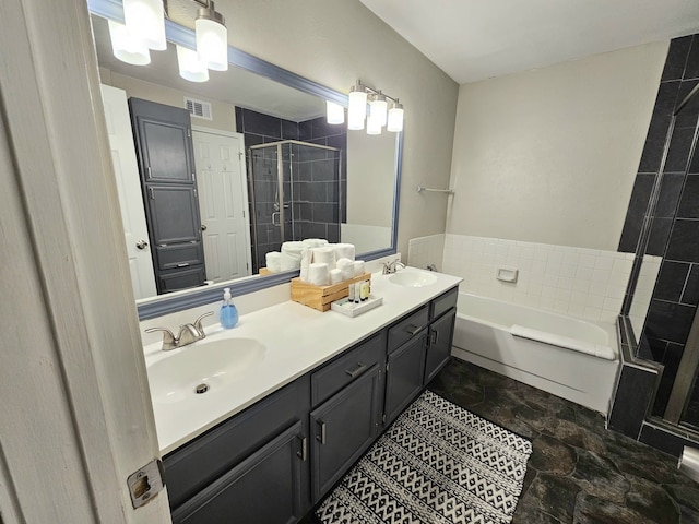 5913 Lake Hubbard Pkwy Unit 124, Garland, TX 75043 - bathroom featuring a shower stall, a garden tub, and double vanity