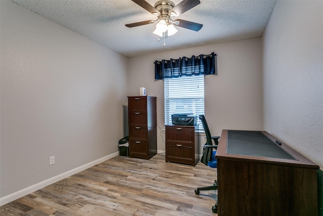 649 Timberline Dr, Hurst, TX 76053 - home office with light wood-type flooring, ceiling fan, a textured ceiling, and baseboards