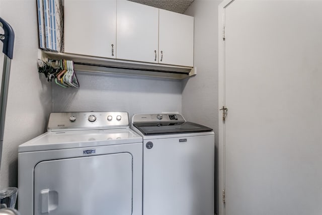 649 Timberline Dr, Hurst, TX 76053 - laundry room with washer and clothes dryer and cabinet space