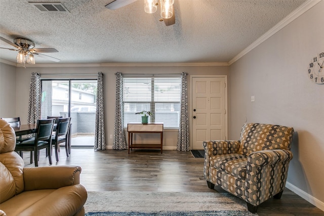 649 Timberline Dr, Hurst, TX 76053 - living room with a ceiling fan, crown molding, a textured ceiling, wood finished floors, and baseboards