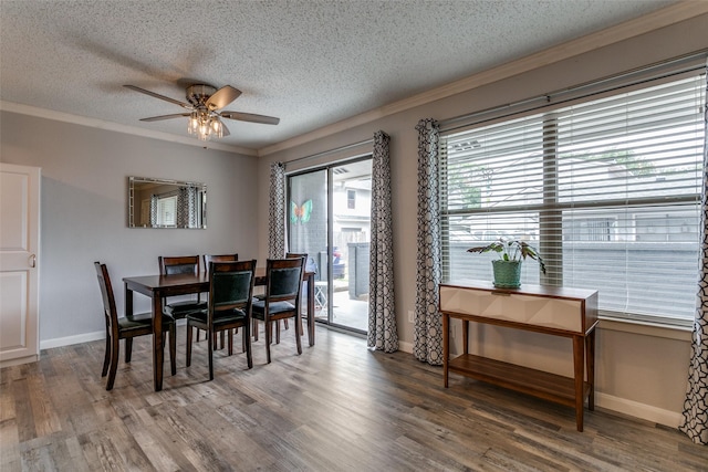 649 Timberline Dr, Hurst, TX 76053 - dining space with a textured ceiling, crown molding, ceiling fan, wood finished floors, and baseboards