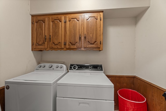 208 Ashe Bend Dr, Rowlett, TX 75087 - laundry area with independent washer and dryer, cabinet space, and wainscoting