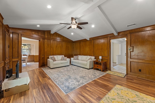 208 Ashe Bend Dr, Rowlett, TX 75087 - living room featuring light wood-style floors, wooden walls, ceiling fan, and recessed lighting