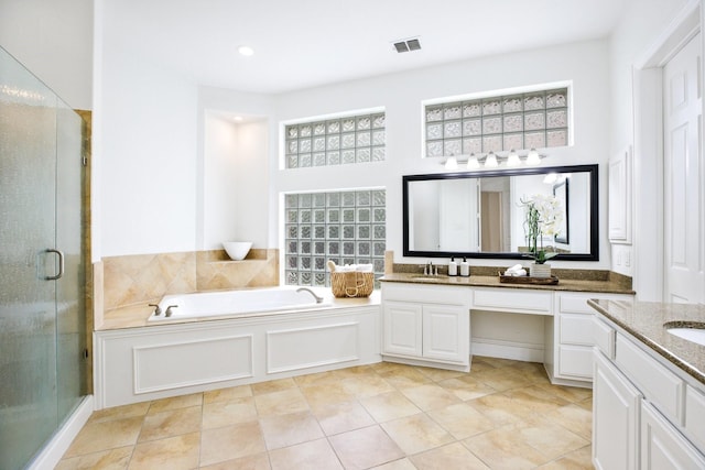 1331 Crockett Dr, Frisco, TX 75033 - full bath with vanity, a garden tub, a stall shower, and tile patterned floors