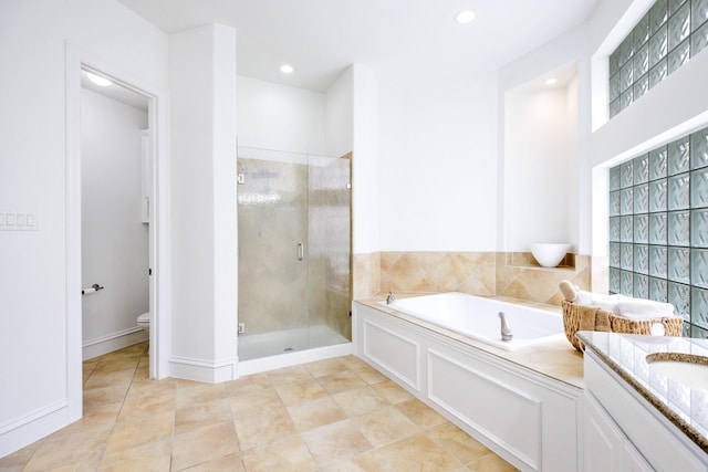 1331 Crockett Dr, Frisco, TX 75033 - bathroom featuring a bath, a stall shower, toilet, tile patterned flooring, and recessed lighting