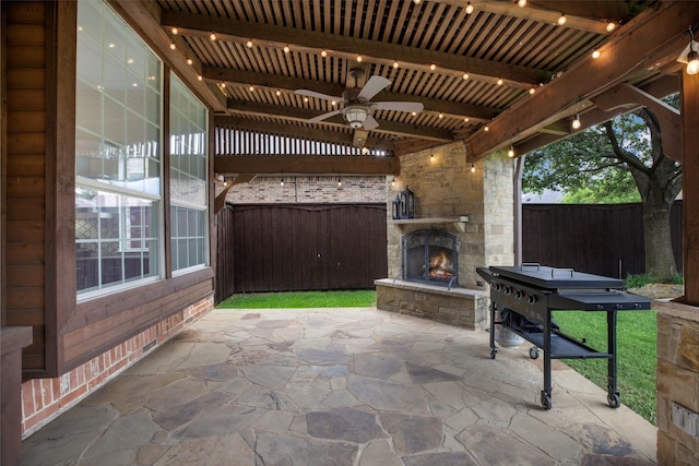 1331 Crockett Dr, Frisco, TX 75033 - view of patio with an outdoor stone fireplace and a ceiling fan
