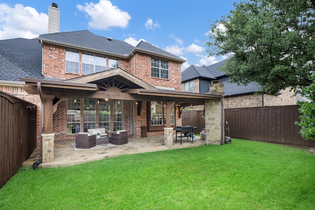 1331 Crockett Dr, Frisco, TX 75033 - back of house with brick siding, a shingled roof, a chimney, an outdoor living space, and a patio