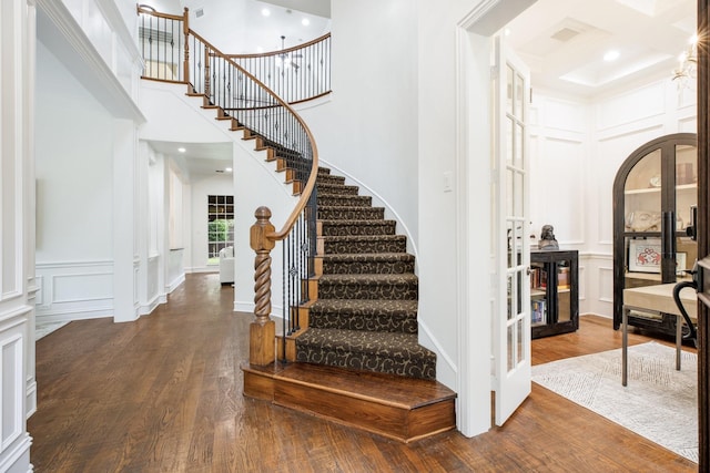 1331 Crockett Dr, Frisco, TX 75033 - entryway featuring a decorative wall, a high ceiling, wood finished floors, stairway, and beam ceiling