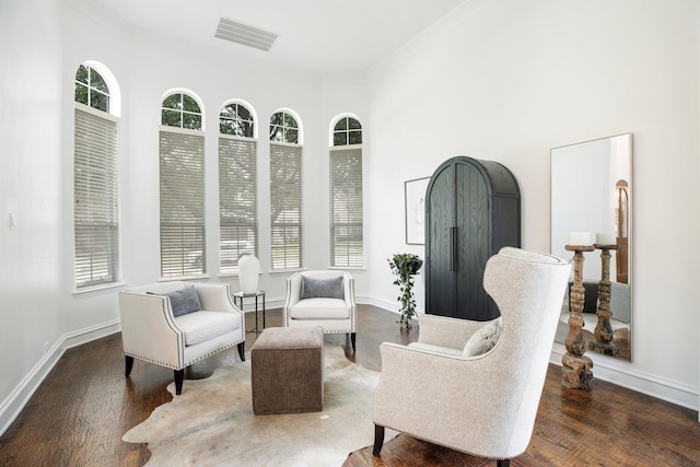 1331 Crockett Dr, Frisco, TX 75033 - sitting room featuring ornamental molding, plenty of natural light, baseboards, and wood finished floors
