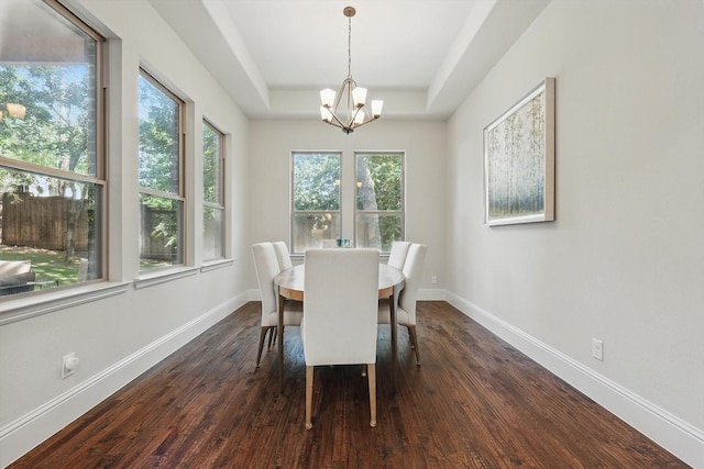 125 Chisholm Trl, Highland Village, TX 75077 - dining space with a chandelier, a raised ceiling, dark wood-style floors, and baseboards