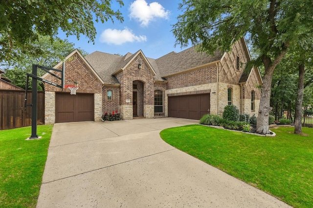125 Chisholm Trl, Highland Village, TX 75077 - french country style house featuring concrete driveway, roof with shingles, a garage, and stone siding