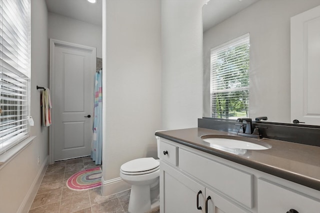125 Chisholm Trl, Highland Village, TX 75077 - bathroom featuring baseboards, vanity, toilet, stone finish floors, and curtained shower
