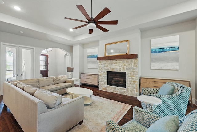125 Chisholm Trl, Highland Village, TX 75077 - living room featuring ceiling fan, recessed lighting, arched walkways, dark wood-style floors, and a fireplace