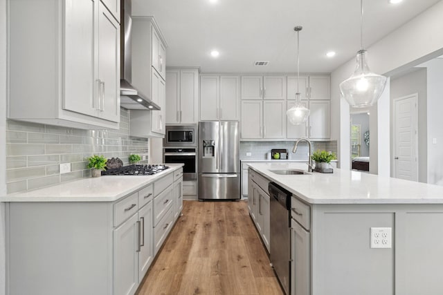 1416 Bearpath Way, Gunter, TX 75058 - kitchen featuring stainless steel appliances, a sink, light wood finished floors, decorative backsplash, and recessed lighting