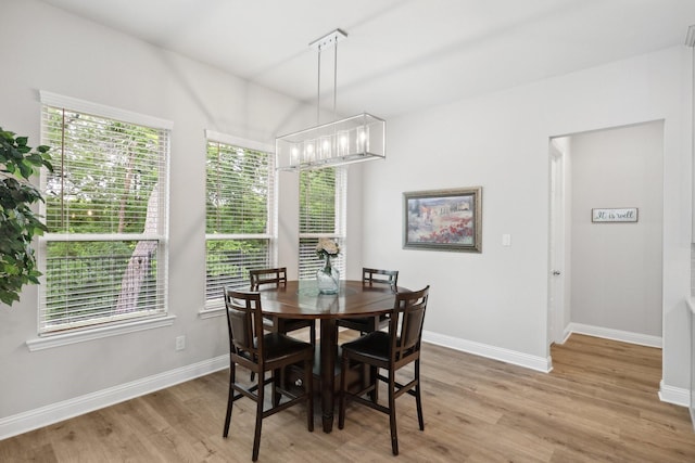 1416 Bearpath Way, Gunter, TX 75058 - dining room with light wood-style floors, baseboards, and a chandelier