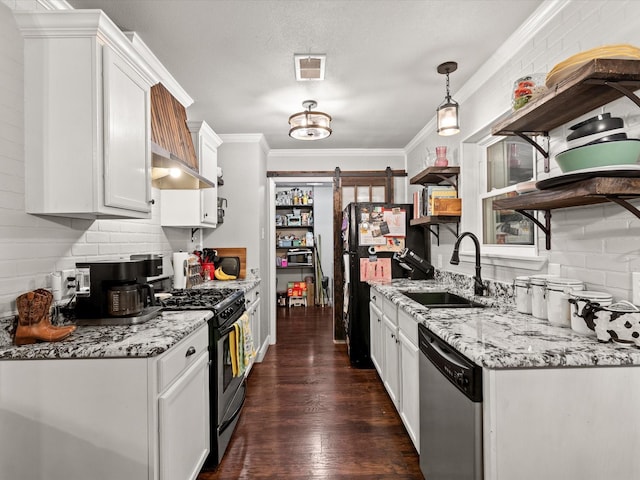 536 Nathan St, Burleson, TX 76028 - kitchen with appliances with stainless steel finishes, open shelves, a barn door, white cabinets, and ornamental molding