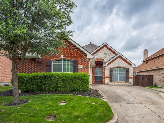 3604 Camino Trl, Mckinney, TX 75070 - view of front facade featuring stone siding and brick siding