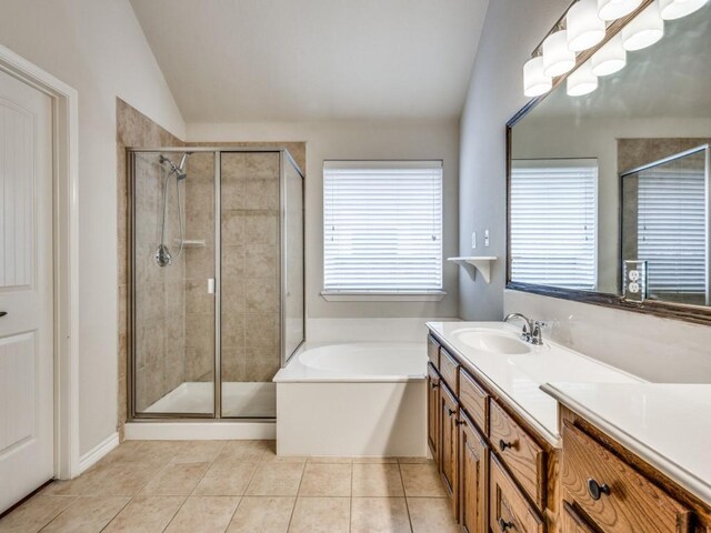 3604 Camino Trl, Mckinney, TX 75070 - full bathroom with lofted ceiling, vanity, a garden tub, a stall shower, and tile patterned flooring
