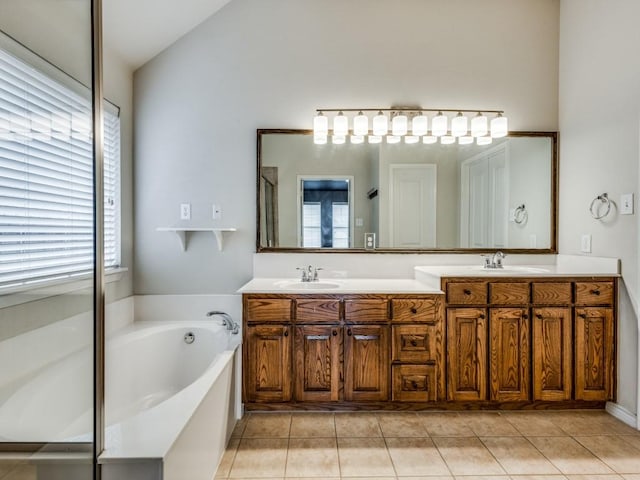 3604 Camino Trl, Mckinney, TX 75070 - full bath featuring double vanity, tile patterned flooring, a bath, and vaulted ceiling