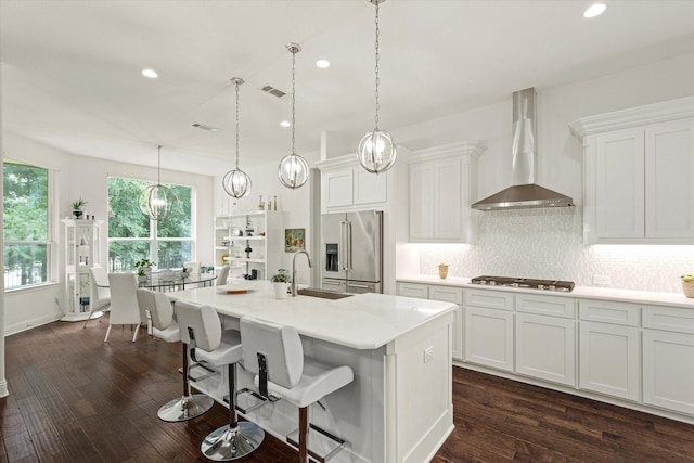 10933 Smoky Oak Trl, Flower Mound, TX 76226 - kitchen featuring stainless steel appliances, wall chimney range hood, a sink, recessed lighting, and backsplash