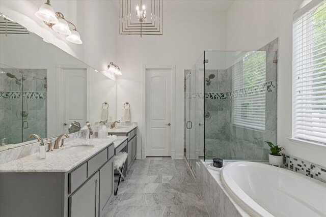 10933 Smoky Oak Trl, Flower Mound, TX 76226 - bathroom with vanity, a bath, a stall shower, and healthy amount of natural light