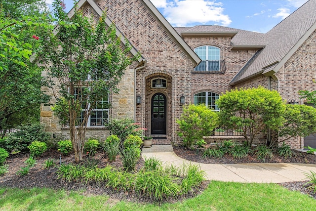 10933 Smoky Oak Trl, Flower Mound, TX 76226 - french country inspired facade featuring brick siding and a shingled roof