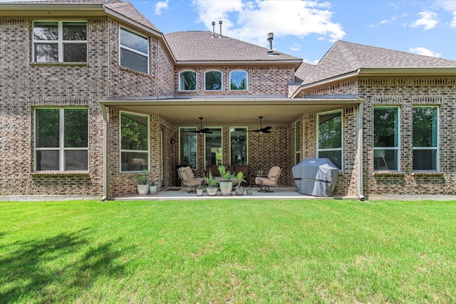 10933 Smoky Oak Trl, Flower Mound, TX 76226 - back of property featuring a patio, brick siding, a yard, and a shingled roof