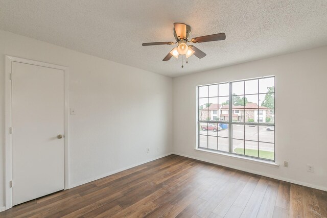 920 Turtle Cv Unit 252, Irving, TX 75060 - unfurnished room featuring healthy amount of natural light, wood finished floors, a textured ceiling, ceiling fan, and baseboards