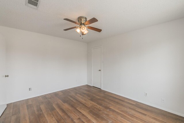 920 Turtle Cv Unit 252, Irving, TX 75060 - spare room featuring ceiling fan, wood finished floors, baseboards, and a textured ceiling