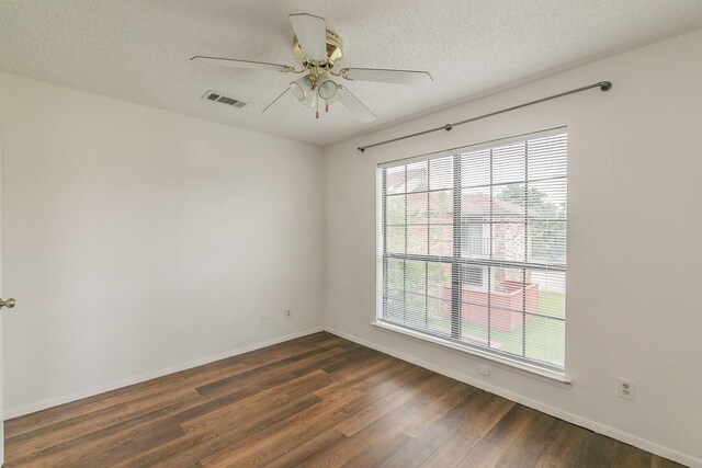 920 Turtle Cv Unit 252, Irving, TX 75060 - spare room with dark wood finished floors, baseboards, a textured ceiling, and a ceiling fan