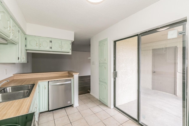 920 Turtle Cv Unit 252, Irving, TX 75060 - kitchen with dishwasher, green cabinets, a sink, light tile patterned floors, and butcher block countertops