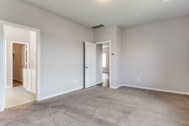 2089 Hartley Dr, Forney, TX 75126 - unfurnished bedroom featuring carpet flooring, baseboards, and connected bathroom