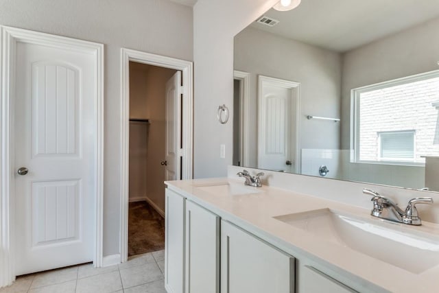 2089 Hartley Dr, Forney, TX 75126 - full bathroom with tile patterned flooring, double vanity, and a walk in closet