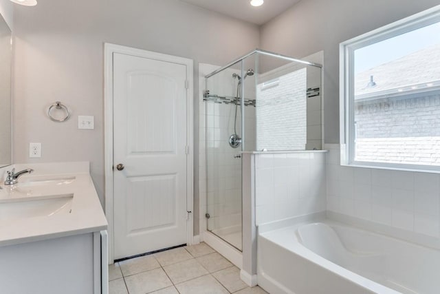 2089 Hartley Dr, Forney, TX 75126 - full bath featuring a garden tub, a stall shower, tile patterned flooring, and double vanity