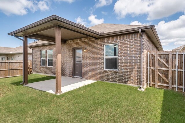 2089 Hartley Dr, Forney, TX 75126 - back of house featuring brick siding and a patio area