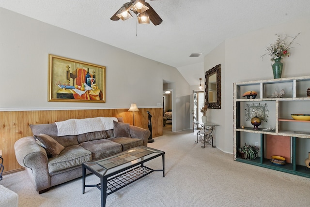 1508 Haven Pl, Allen, TX 75002 - carpeted living room featuring ceiling fan, lofted ceiling, a wainscoted wall, and wood walls