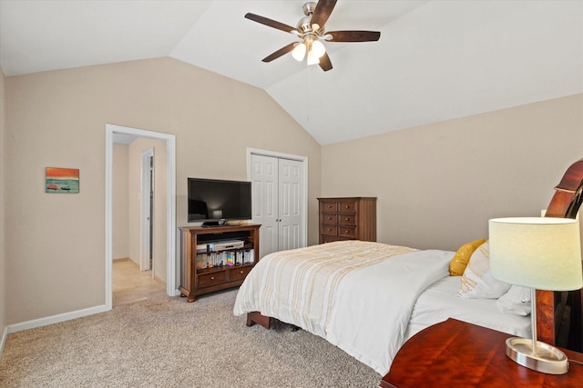 2000 Arles Ln, Carrollton, TX 75007 - bedroom with a closet, vaulted ceiling, light colored carpet, a ceiling fan, and baseboards