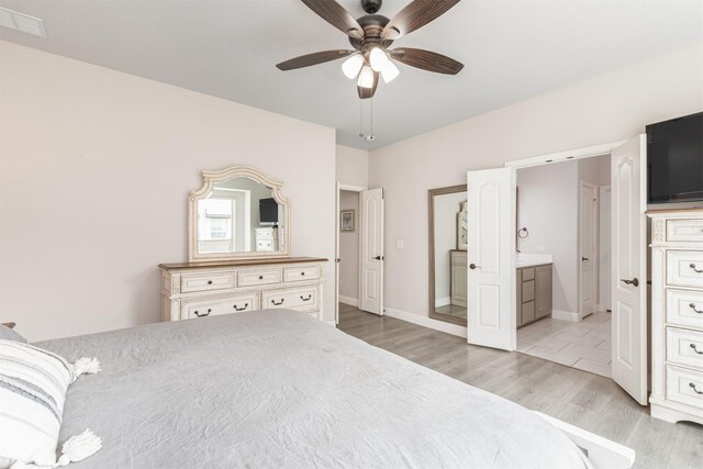 2014 Slow Stream Dr, Royse City, TX 75189 - bedroom with light wood-type flooring, connected bathroom, ceiling fan, and baseboards