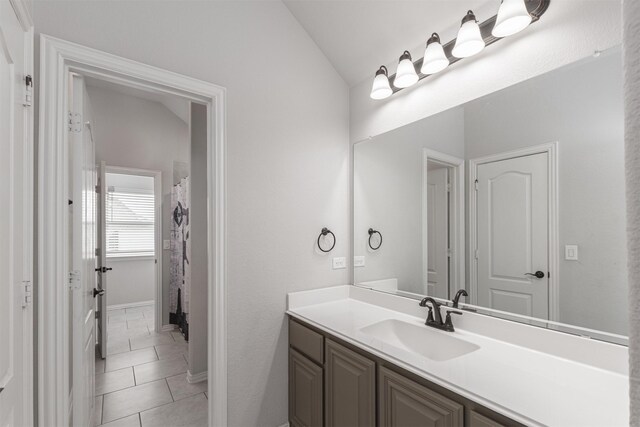 2014 Slow Stream Dr, Royse City, TX 75189 - full bath with lofted ceiling, vanity, and tile patterned flooring