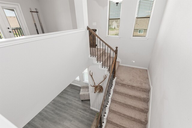 2014 Slow Stream Dr, Royse City, TX 75189 - staircase with healthy amount of natural light, baseboards, and wood finished floors