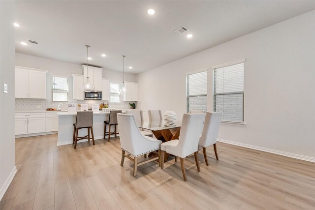 4557 Ward St, North Richland Hills, TX 76180 - dining area with light wood-style floors, recessed lighting, and baseboards