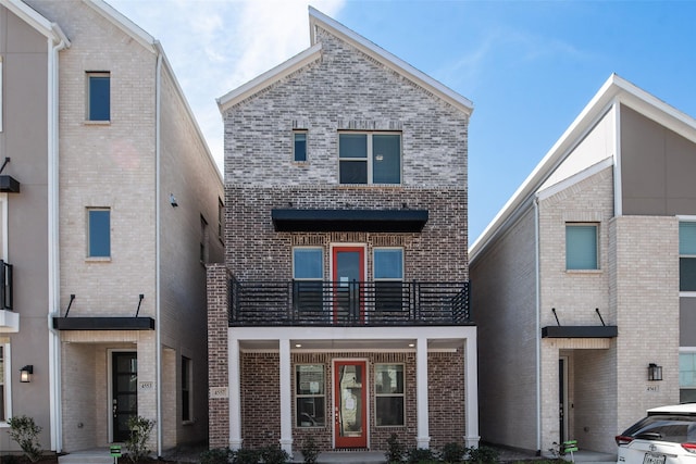 4557 Ward St, North Richland Hills, TX 76180 - view of front of property with brick siding and a balcony